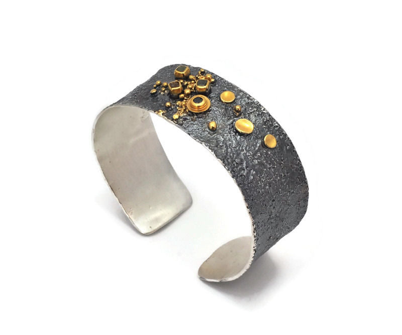 Armreif Silber vergoldet, geschwärzt, schwarzer Diamant, drei Rohdiamanten