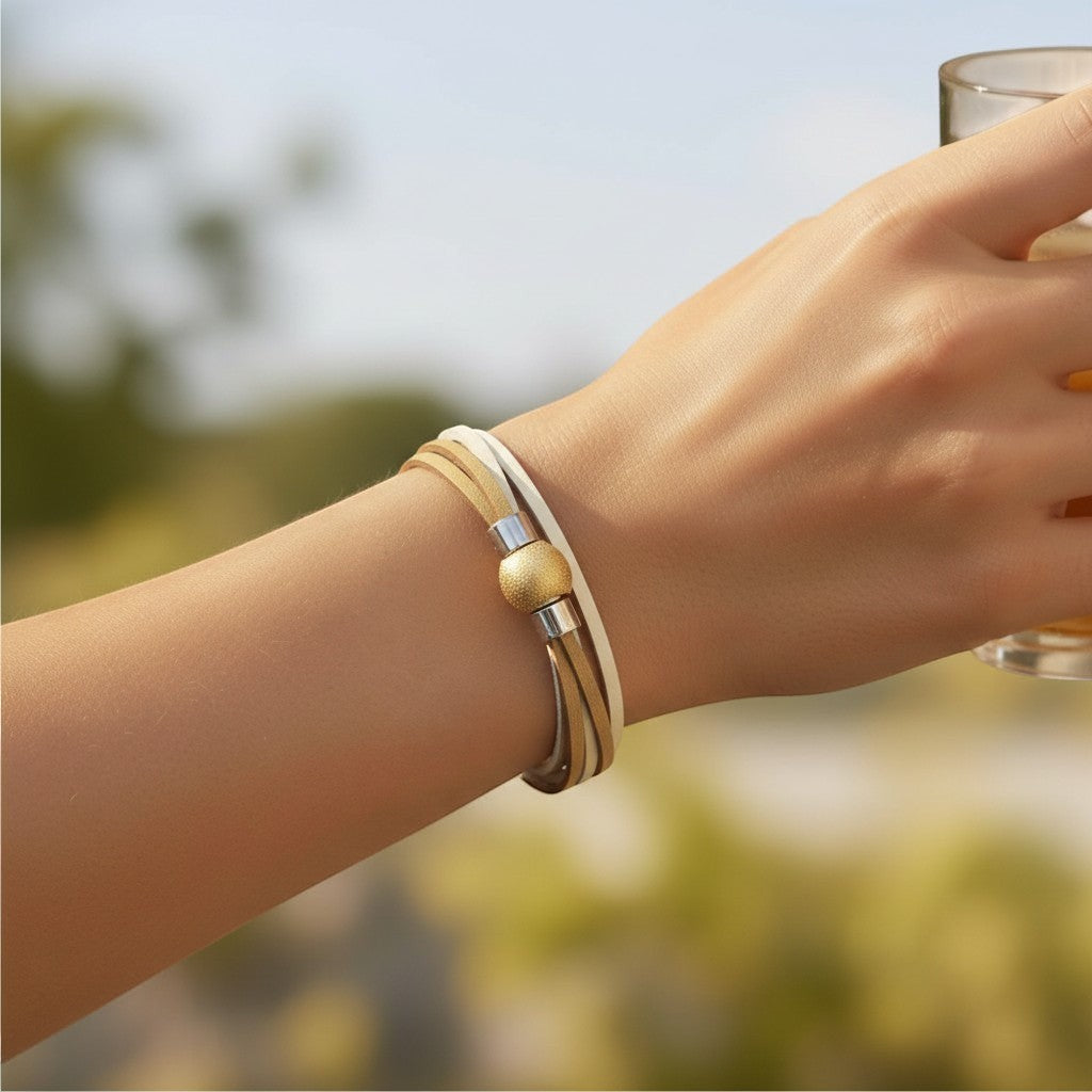 Peter Bijoux Modeschmuck multi-strand faux leather wrap bracelet in natural tones with a gold textured magnetic clasp.