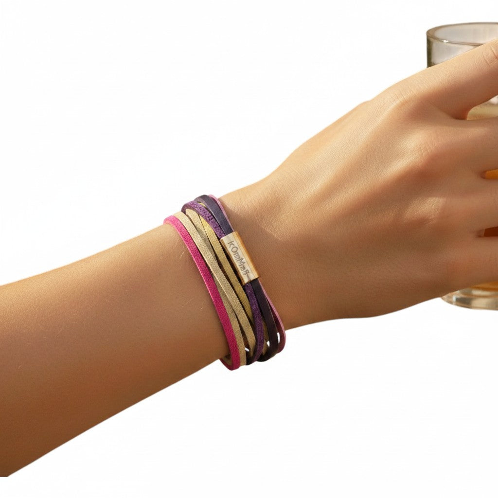 Peter Bijoux Modeschmuck Tini double wrap bracelet with 6 faux leather strands in pink, purple, and beige with a gold magnetic clasp.