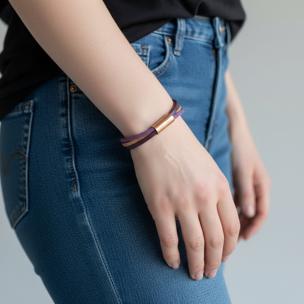 Peter Bijoux Modeschmuck multi-strand faux leather wrap bracelet in purple, pink, and gold tones with a rose gold magnetic clasp.