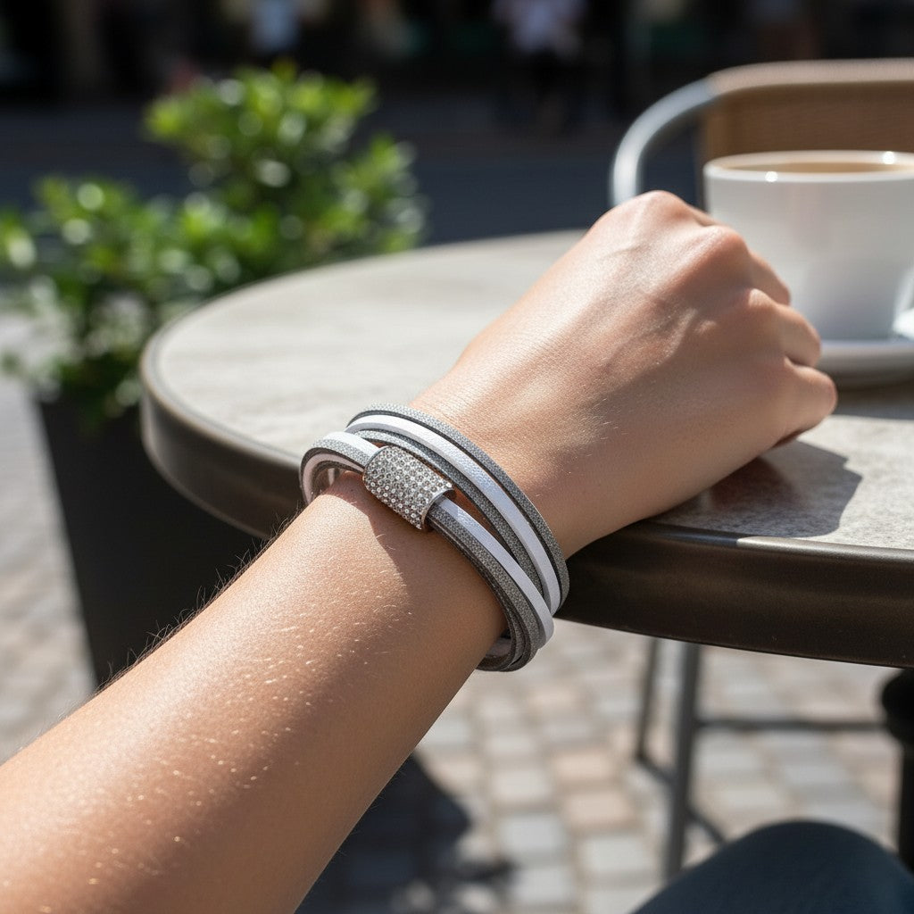 Peter Bijoux Modeschmuck Christina bracelet with 6 faux leather straps in white and grey, double-wrapped with a crystal-embellished magnetic clasp.